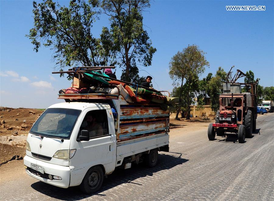 SYRIA-DARAA-CIVILIANS-RETURN-HOME