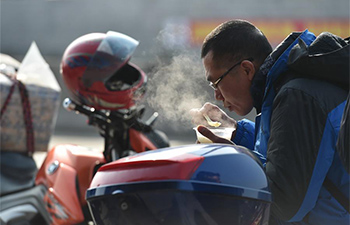 Migrant workers in south China go home by motorcycle during Spring Festival travel rush